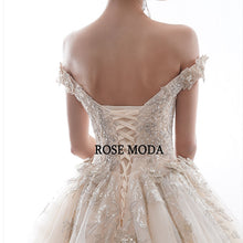 Load image into Gallery viewer, RoseModaLuxuryOfftheShoulderIvoryandChampagneLaceWeddingDresswithLongTrainCustomMake-f.jpg