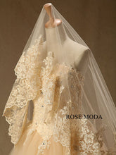Load image into Gallery viewer, rosemoda-champagne-lace-ball-gown-wedding-dress-with-long-veil-h.jpg