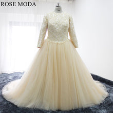 Load image into Gallery viewer, rosemoda-champagne-plus_muslim-wedding-dress-with-long-sleeve-a.jpg