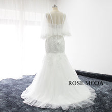 Load image into Gallery viewer, rosemoda-lace-mermaid-wedding-dress-with-removable-cape-b.jpg