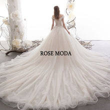 Load image into Gallery viewer, RosemodaLuxuryOffShoulderWeddingDresswithCrystalsLaceUpBackLongTrain-b.jpg
