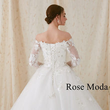 Load image into Gallery viewer, Rosemoda Off-the-shoulder Long Sleeve Ball Gown Wedding Dress
