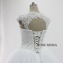 Load image into Gallery viewer, rosemoda-heavy-beaded-ball-gown-wedding-dress-with-detachable-lace-bolero-i.jpg
